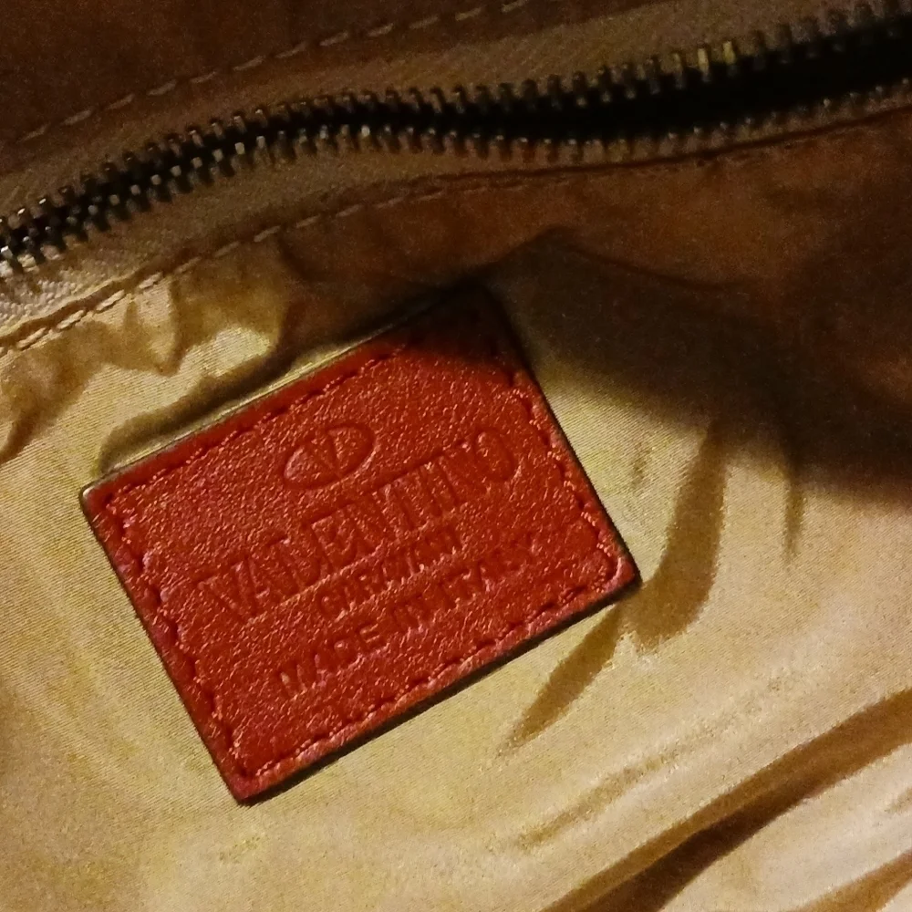 Valentino Garavani pouch.